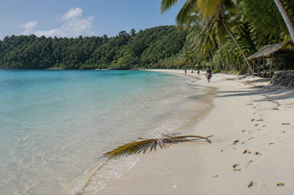 Clear shallow water over sand at a Vanuatu island beach