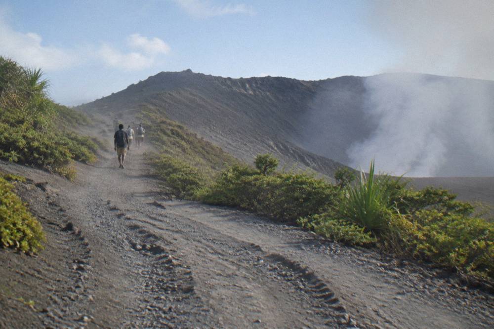 Four wheel drive track climbing the ash slopes toward the Mount Yasur crater rim