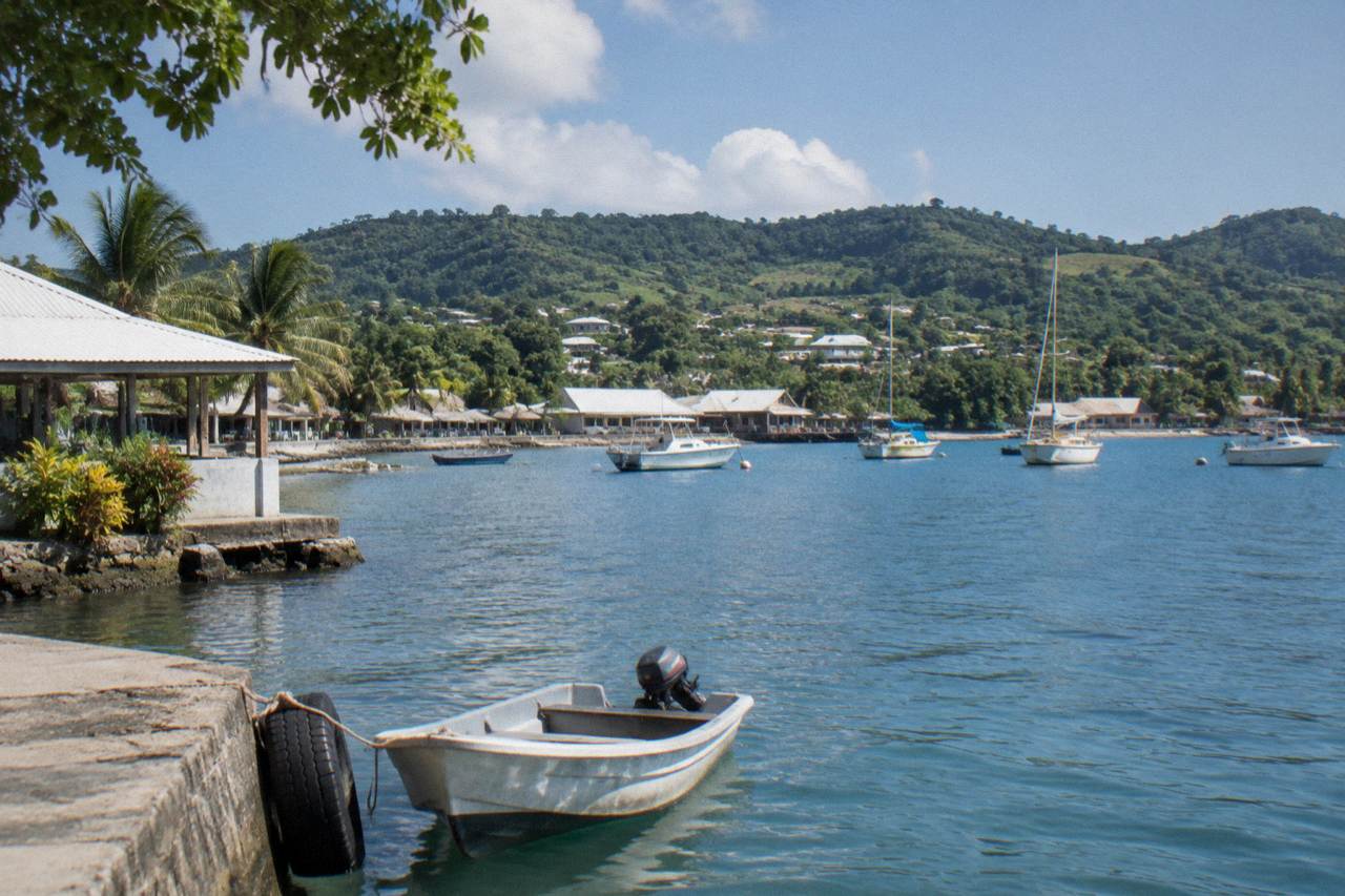Harbour water and green hillsides around Port Vila with small boats at anchor