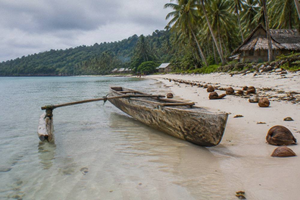 Clear shallow water over pale sand at a Santo beach